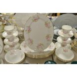 An Albany bone china tea and dinner service decorated with roses and garden flowers comprising of