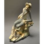 A Lladro figure group - Alpine boy and dog seated, incised and printed marks.