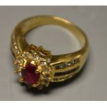 A ruby and diamond cluster ring, central red ruby, approx 0.