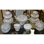 A Paragon six-setting floral tea service, comprising teapot, milk jug and sugar bowl, cups,