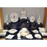 A Royal Crown Derby Posie pattern mantel clock, boxed; a ginger jar and cover, boxed; an Easter egg,