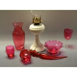 Glassware - a Victorian opaque white oil lamp;  a cranberry glass pipe;