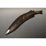 Militaria - a World War Two period kukri, unmarked leather scabbard, c.