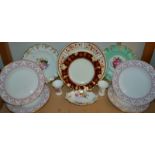 A Royal Crown Derby Honeysuckle pattern plate; a Floral Garnet plate; a Vine plate;
