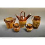 Stoneware - a Victoria commemorative 1897 jug; a tyg; an Old Sarum kettle; a treacle glazed jug;