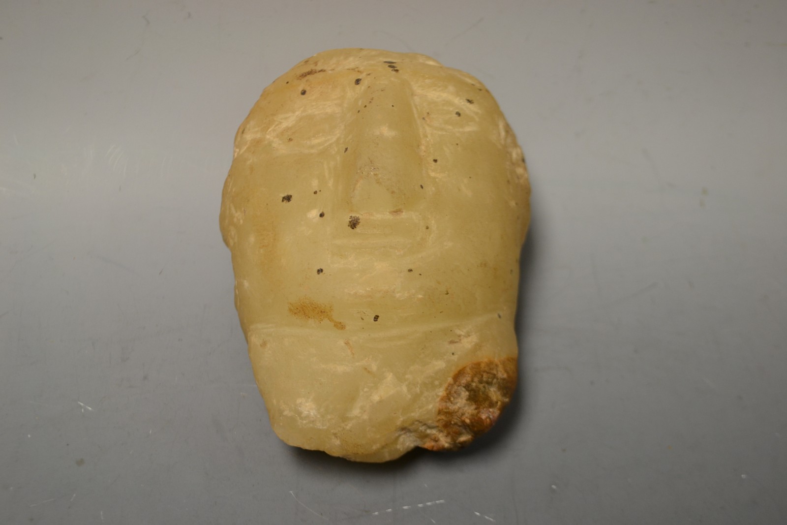 Sergio Simone, a soapstone carving, Nico, a fragmented profile after the antique, signed,