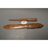 A teak letter knife, with plaque inscribed H.M.S.