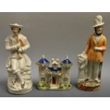 A 19th century Staffordshire cottage and two figures (3)