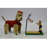 A tin plate poodle, tartan body and hat,