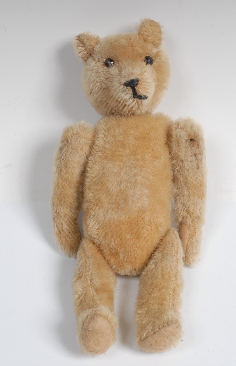 A golden mohair jointed Teddy Bear, metal stud button eyes , pointed stitched nose,