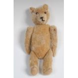 A golden mohair jointed Teddy Bear, metal stud button eyes , pointed stitched nose,