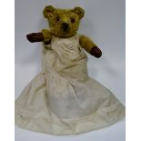 An early 20th century mohair jointed bear, horizontally stitched nose, small ears, 51.5cm high, c.