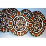 Four Royal Crown Derby 1128 circular dinner plates, printed marks; two others,