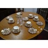 A set of six Royal Crown Derby 1128 breakfast cups and saucers,8 side plates,