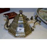 An Orientalist silver plated octagonal teapot, the spout as a dragon,