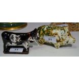 A pottery speckled pig money bank, in mottled tones of green,