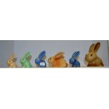 A Sylvac Rabbit 106; another; others; a Stoneware Cottontail rabbit;