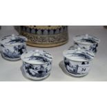 A set of four Japanese lidded circular cups, decorated in underglaze grey,