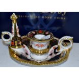 A Royal Crown Derby 1128 pattern chamberstick and snuffer,