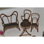 Toys and Juvenalia - a doll's wicker and tooled leather four-piece drawing-room suite,