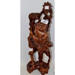 An Oriental hardwood carving of an Immortal