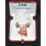 A pair of coloured and white majorican pearl and diamond chip earrings