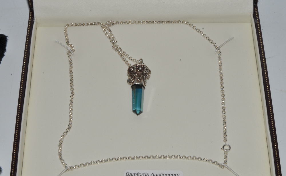 A silver pendant necklace,