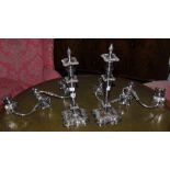 A pair of table candlesticks, campana shaped sconces, tapering cylindrical columns,