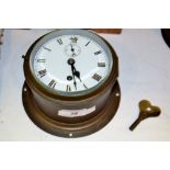 An early 20th century brass ship's clock, Arabic numerals,