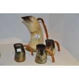 A horn jug with bamboo handle;