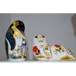 A Royal Crown Derby paperweight, Seal, silver stopper; another Penguin and Baby,