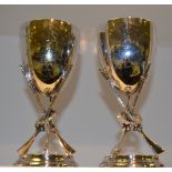 A pair of Victorian EPNS Shooting trophies, the bowls supported on three crossed rifles, c.