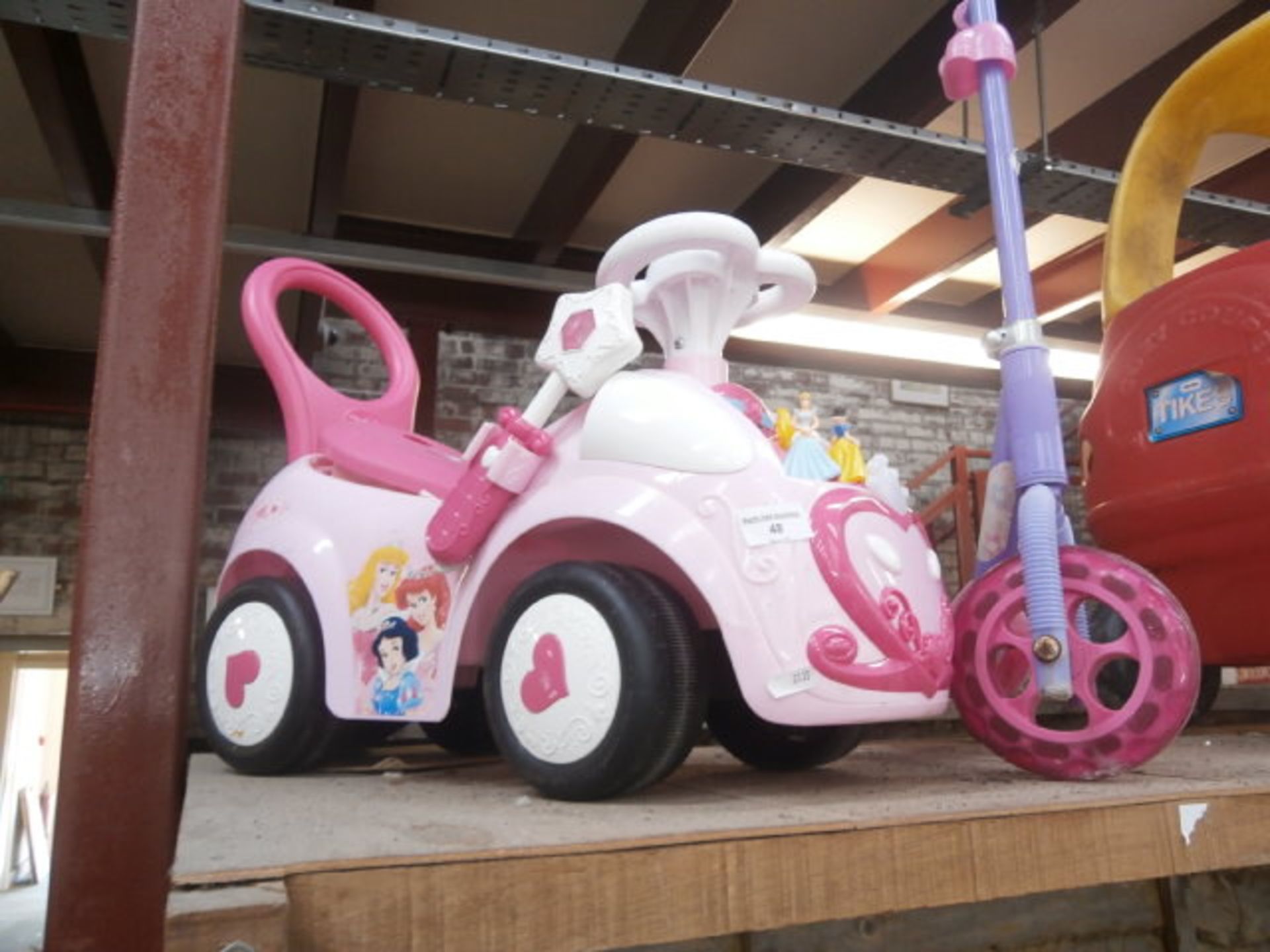 Childs scooter and a princess buggy