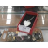 silver heart locket on chain