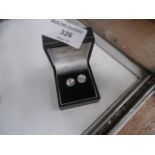 pair of silver and CZ earrings