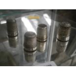 4 hall marked  silver thimbles