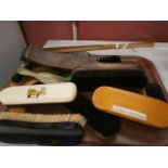 tray of vintage shoe and clothes brushes