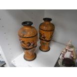 pair of stoneware hunting scene vases