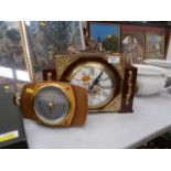 decorative clock and a barometer