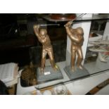 pair of heavy metal golfing figurines