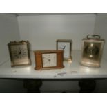 shelf of carriage clocks and a small smiths clock