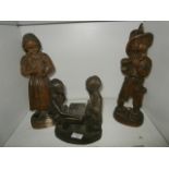 3 carved wooden figurines