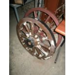 wooden cart wheel and 1 other