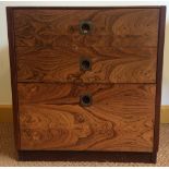 A Pair of 1950’s rosewood bedside tables with three graduated drawers with military brass flush