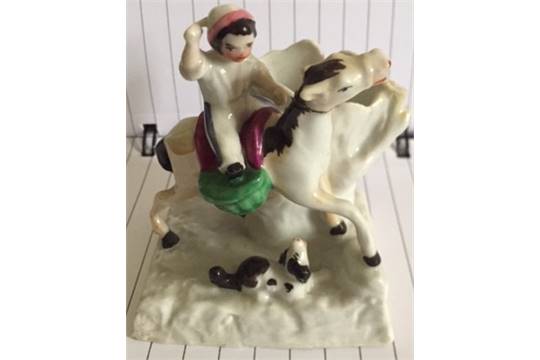 A collection of three English porcelain C19th figure groups one of child riding pony, cat group