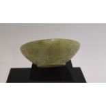 A miniature C19th Mughal jade carved bowl (NAD Ali) The carved rim with Arabic script and fine