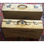 A Pair of Vintage white rawhide travel suitcases with original hotel badges and initialed in