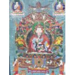 A large Tibetan C 18/19th Century panel, painted in the centre with one of the eight Padmasamhava,