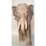 A set of four elaborate terracotta elephants. H 41cm W 16cm