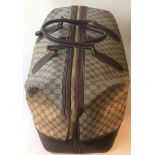 A pre owned large Gucci duffle bag, Beige/Ebony GG supreme, brown leather trim with double handles.